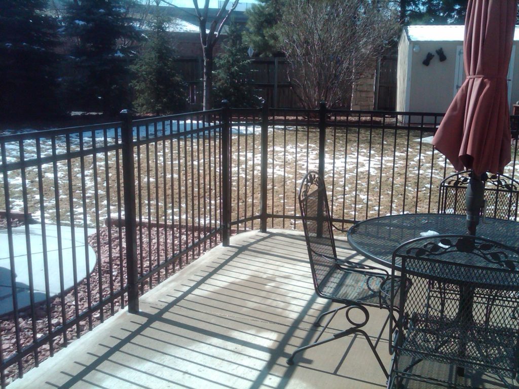a patio surrounded by wrought iron fence in Colorado