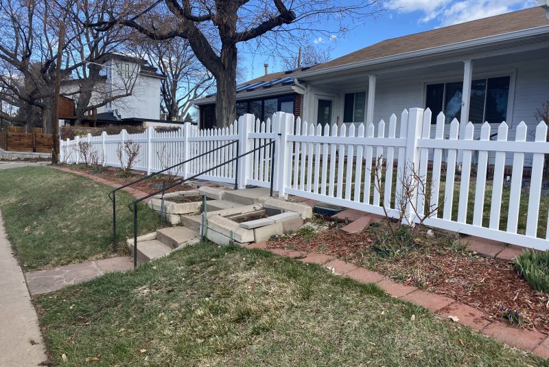 White vinyl fence serving as a residential gate in Denver